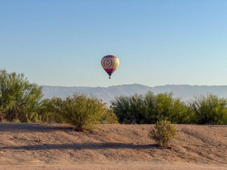 Hot air balloon rising at sunrise over the Coachella Valley